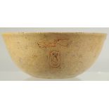 AN UNUSUAL EGYPTIAN STONE BOWL, with fine carvings to the exterior and centre interior, 13.5cm