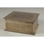 A FINE IRANIAN GOLD INLAID METAL BOX, 14cm x 11.5cm.