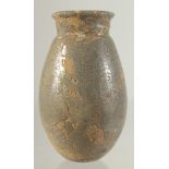 A SMALL STONE VASE WITH UNUSUAL METALLIC SPECKLED GLAZE, 12cm high.