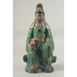 A LARGE CHINESE SANCAI SEATED GUANYIN AND CHILD, possibly Ming, glazed with green, turquoise,