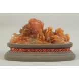 A FINE EARLY 20TH CENTURY CHINESE SOAPSTONE LANDSCAPE GROUP, with purpose-made stand and fitted box,