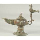 A LARGE SELJUK KHORASAN BRONZE OIL LAMP, with twin animal finials to each side and large bird form