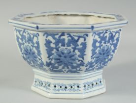 A 20TH CENTURY CHINESE OCTAGONAL BLUE AND WHITE JARDINIERE, decorated with floral motifs, 25.5cm