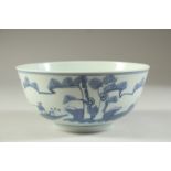 AN EARLY 20TH CENTURY CHINESE BLUE AND WHITE PORCELAIN BOWL, painted with a figure in a landscape,