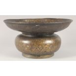 A FINE INDIAN BRONZE BASIN, with foliate decoration, 34cm diameter.