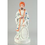 A 19TH CENTURY EUROPEAN PORCELAIN FIGURE OF AN OTTOMAN SULTAN, 29cm high.