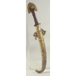 AN ISLAMIC BRASS MOUNTED DAGGER, 43cm long.