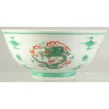 A CHINESE FAMILLE VERTE PORCELAIN BOWL, decorated with roundels of dragons, character mark to