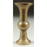 A SMALL CHINESE BRASS GU SHAPE VASE, 10cm high.