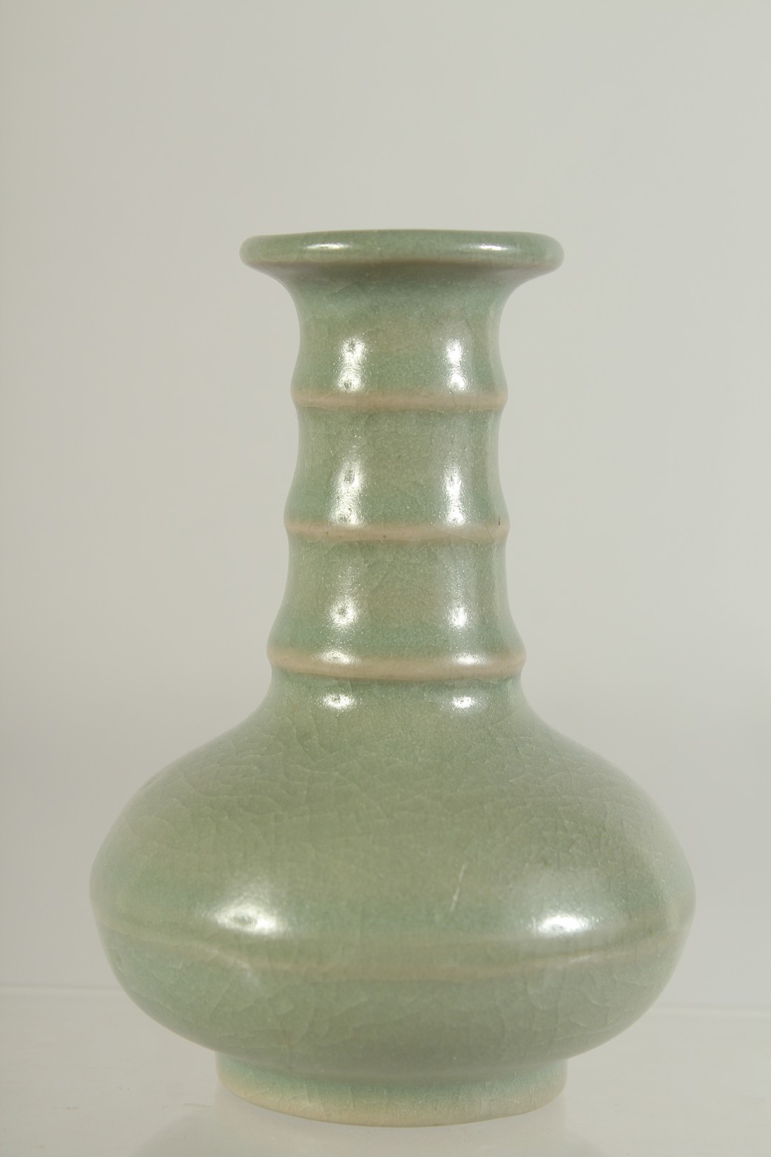 A SMALL CHINESE CELADON GLAZE VASE, 10cm high. - Image 2 of 5