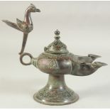 A SEJUK KHORASAN OPENWORKED BRONZE TWIN-SPOUTED OIL LAMP, the handle with bird finial, 25cm long (