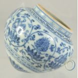 A CHINESE BLUE AND WHITE PORCELAIN BIRD FEEDER, with lucky symbols and lotus decoration, 7cm x 8cm.