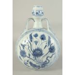 A CHINESE BLUE AND WHITE TWIN HANDLE MOON FLASK VASE, painted with a central floral spray, 33cm