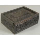 A 19TH CENTURY INDIAN CARVED WOODEN BOX, 11cm x 8.5cm.