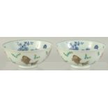 A PAIR OF CHINESE FAMILLE ROSE PORCELAIN BOWLS, the exterior painted with coral red fish, the