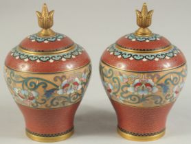 A PAIR OF MID 20TH CENTURY CHINESE CLOISONNE LIDDED JARS, each with a central band of foliate
