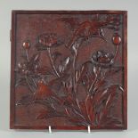 A FINELY CARVED HARDWOOD SQUARE-FORM PANEL, with birds and flowers, 25cm square.