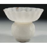 AN 18TH CENTURY INDIAN MUGHAL CARVED WHITE JADE LIDDED BOWL, carved with foliate motifs and petal
