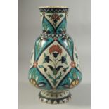 A 19TH CENTURY KUTAHYA GLAZED POTTERY VASE, painted with floral motifs, indistinct signature to