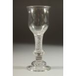A GOOD 18TH CENTURY ENGLISH WINE GLASS with inverted tulip bowl and air twist stem, with knop.
