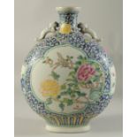 A CHINESE PORCELAIN MOON FLASK with panels of birds and flowers. 14ins high.