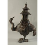 A CHINESE BRONZE EMU CENSER carrying a temple on its back. 16ins high.
