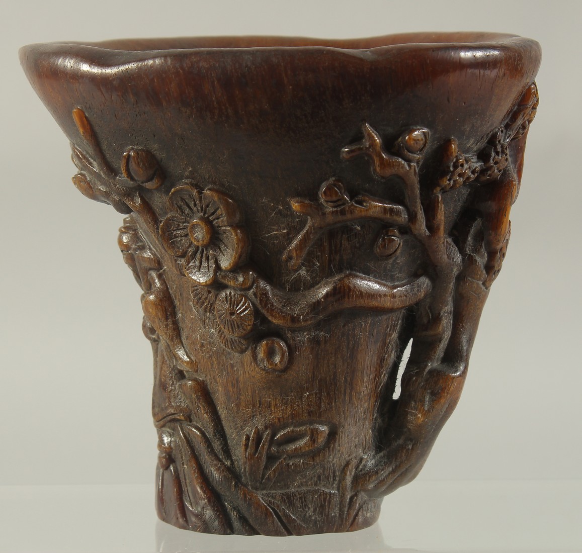 A CHINESE CARVED HORN LIBATION CUP. 5.5ins high.