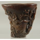 A CHINESE CARVED HORN LIBATION CUP. 5.5ins high.