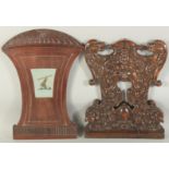 TWO CARVED WOOD CHAIR PANELS ARMORIAL AND GREEN MAN.