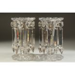 A LARGE PAIR OF 19TH CENTURY CUT GLASS LUSTRES with prism drops and shaped bases. 8ins high along