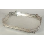 A GOOD ENGRAVED AND SILVER PLATED TWO HANDLED SERVING TRAY with pierced gallery on four curving