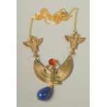 AN EGYPTIAN DESIGN PENDANT AND CHAIN.