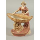 A ROYAL DUX PORCELAIN FIGURE OF A YOUNG LADY holding a sheaf No. 2099. 7ins high.