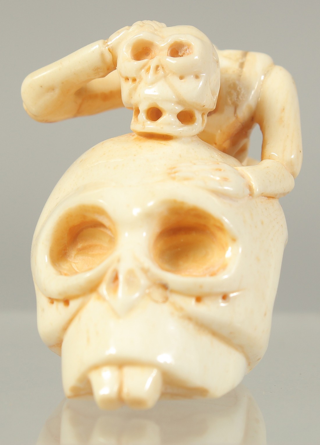 A CHINESE CARVED BONE SKULL AND SKELETON.