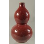 A CHINESE PORCELAIN RED DOUBLE GOURD VASE. 7.5ins high.