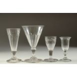 FOUR VARIOUS 18TH CENTURY ENGLISH WINE GLASSES, various heights.