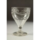 AN 18TH CENTURY IRISH GLASS RUMMER engraved with ribbon motif and garland. 5ins high.