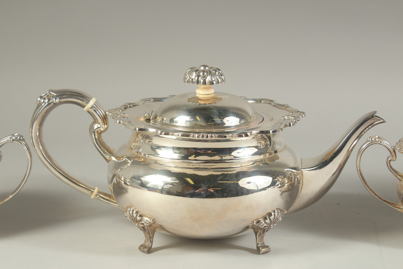 A VERY GOOD FOUR PIECE SILVER CIRCULAR TEA SET of pie crust design with shell mounts, comprising: - Image 3 of 10