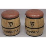A PAIR OF LEATHER TOP GUINNESS BARREL SEATS.