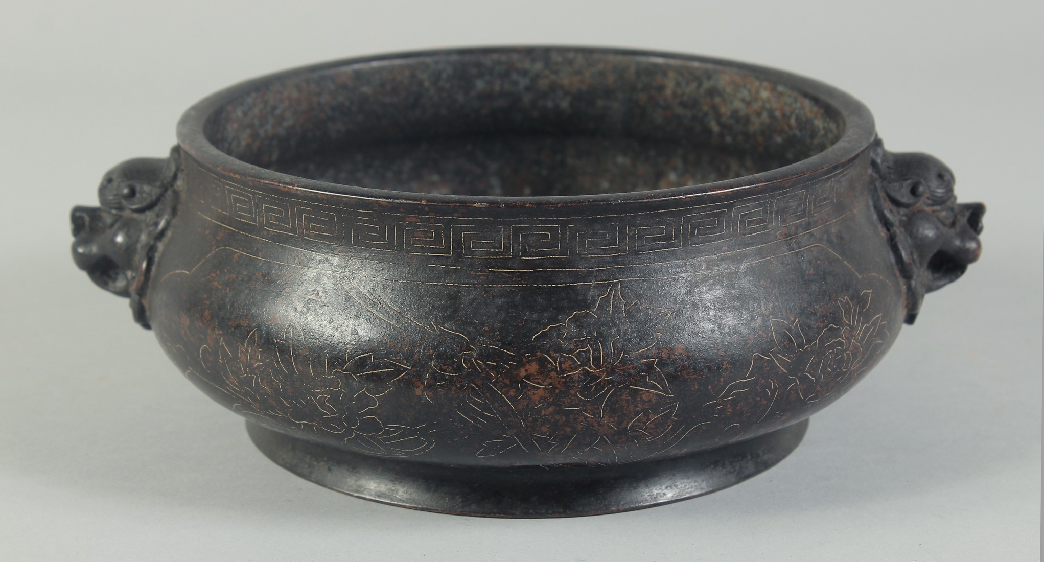 A GOOD CHINESE BRONZE SILVER INLAID CIRCULAR CENSER with dragon handles. 8ins diameter.