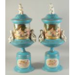 A LARGE PAIR OF SEVRES DESIGN BLUE AND WHITE VASES, BASES AND LIDS, moulded with white porcelain