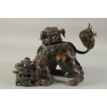 A GOOD CHINESE BRONZE DOG OF FOE GROUP with two dogs. 8ins high.