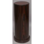 AN ART DECO STYLE ROSEWOOD CIRCULAR PEDESTAL STAND. 2ft 7ins high x 1ft diameter.