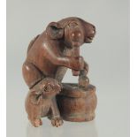 A CARVED WOOD RATS AND DRUM NETSUKE. 4.5cms.