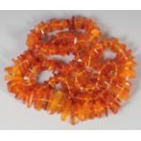 A GOOD FACETED AMBER GRADUATED NECKLACE, 120 beads, 30ins long, 84gms.