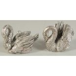 A PAIR OF .925 SILVER SWANS. 2.5ins high.