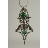 A SCARAB NECKLACE. 3.5ins on a long chain.