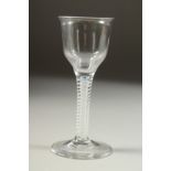 AN 18TH CENTURY ENGLISH WINE GLASS with inverted bowl and air twist stem. 5.5ins high.