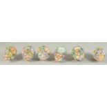 A GOOD SET OF SIX MEISSEN PORCELAIN FLOWER ENCRUSTED TREE DECORATIONS. 3.75ins long.