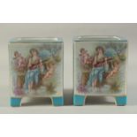 A PAIR OF BLUE SEVRES DESIGN SQUARE CACHES POTS with classical design panel. 7ins high.